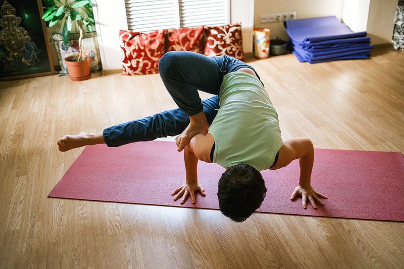 Woman practicing Vinyasa Flow yoga